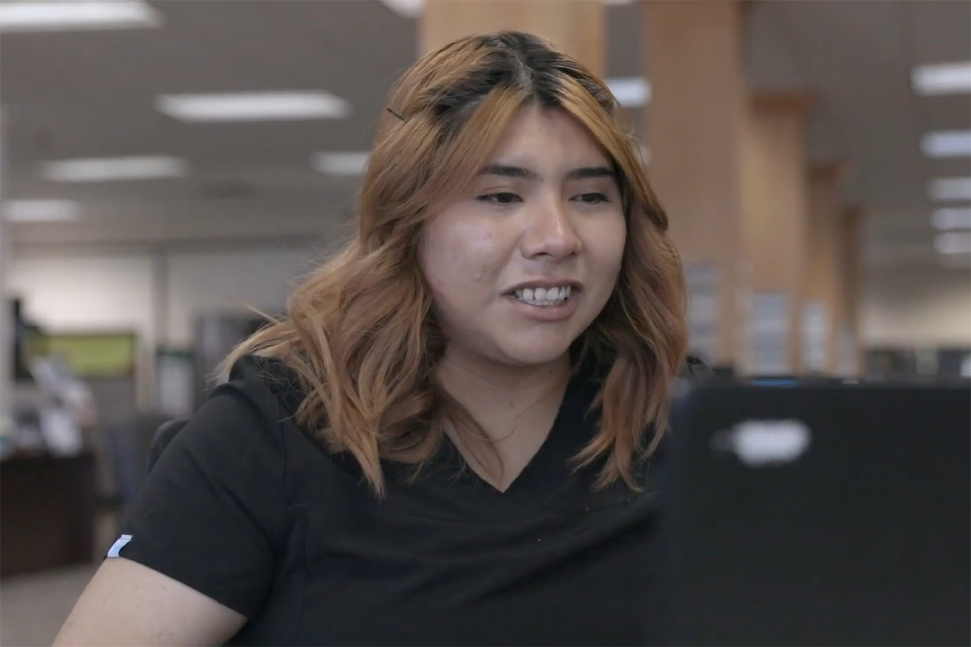 A young woman using a laptop.