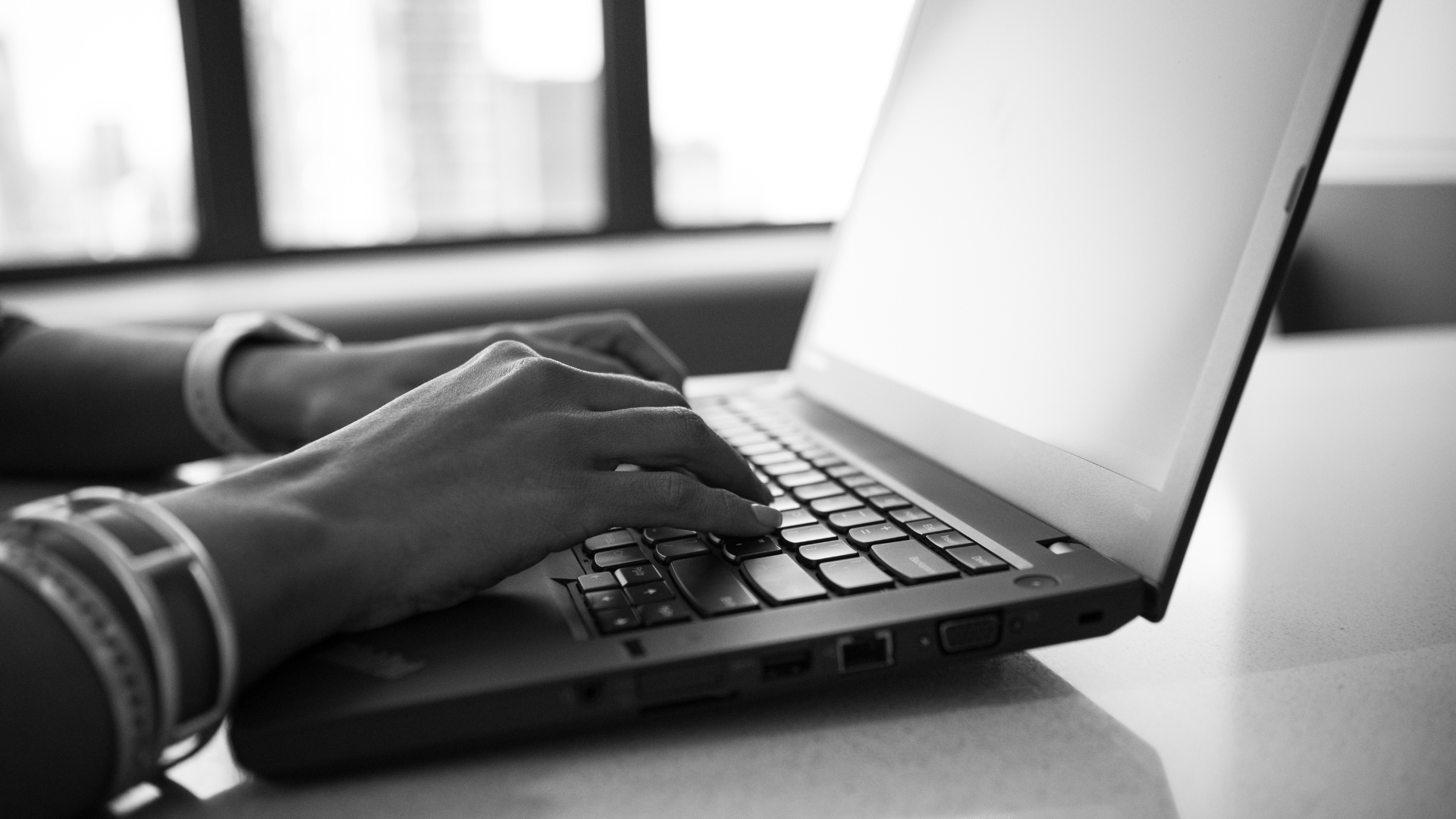 Typing on a laptop computer